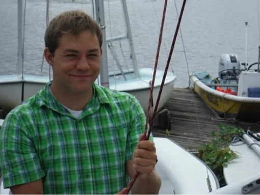 Sailor holding the two ends of the halyard together