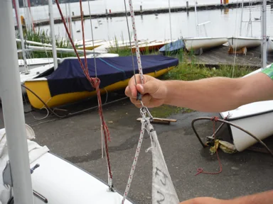 Jib halyard shackle connected to the head of the jib