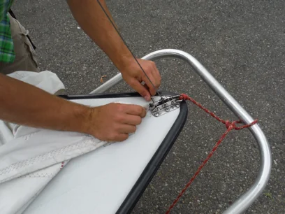 Attaching the jib tack with the retaining pin