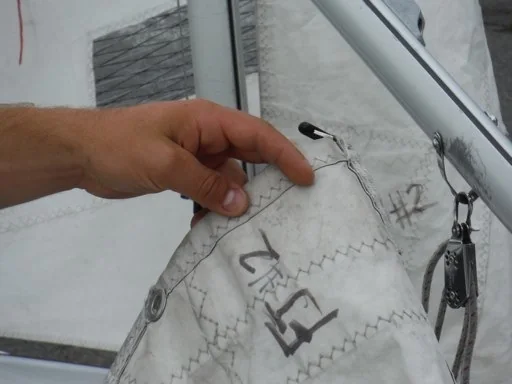 Main-sail tack with Cunningham grommet above it