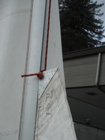 Main sail raised a short distance up the mast