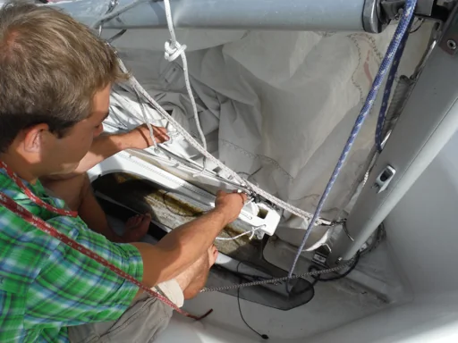 Sailor lowering the FJ centerboard