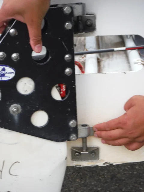 Close view of the rudder retaining clip and gudgeon