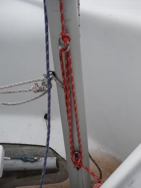 FJ main halyard secured to the mast cleat with a cleat hitch.